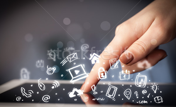 Stock photo: Finger pointing on tablet pc, social media concept