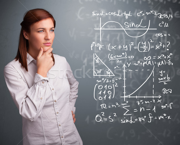 Beautiful school girl thinking about complex mathematical signs Stock photo © ra2studio