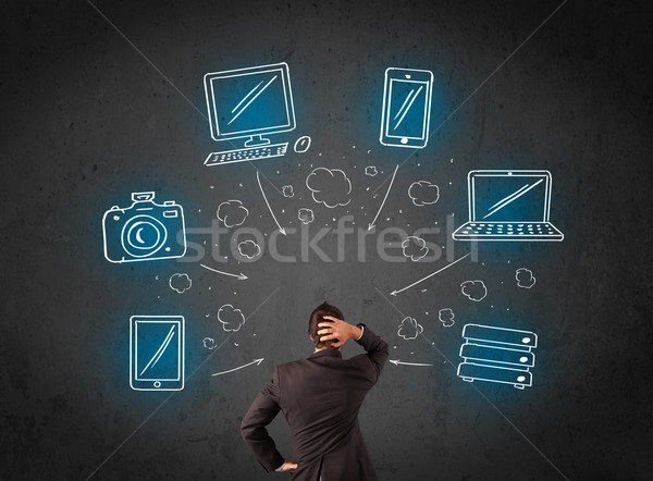 üzletember multimédia ikonok fej fiatal gondolkodik Stock fotó © ra2studio