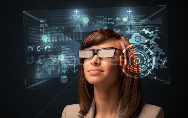 Jeune femme regarder futuriste puce élevé tech [[stock_photo]] © ra2studio