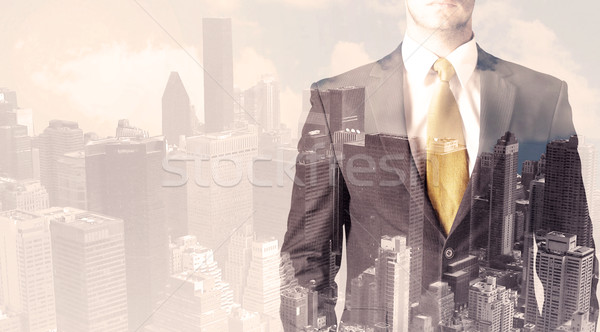 Handsome business man with overlay cityscape Stock photo © ra2studio