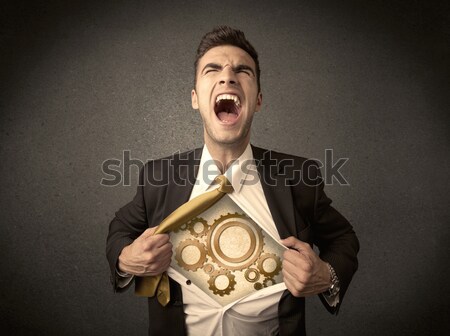 Businessman tearing shirt off and machine cog wheel shows Stock photo © ra2studio