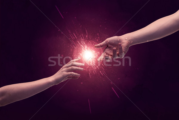 Touching hands light up sparkle in space Stock photo © ra2studio