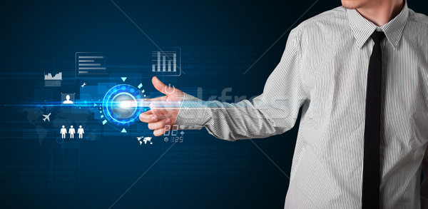 Handsome businessman touching future web technology buttons and  Stock photo © ra2studio