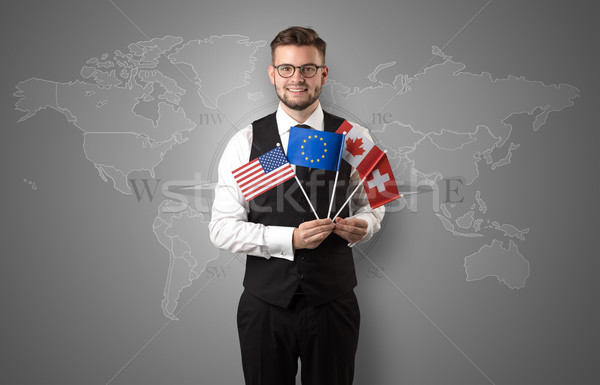 Man standing with flag and map background Stock photo © ra2studio