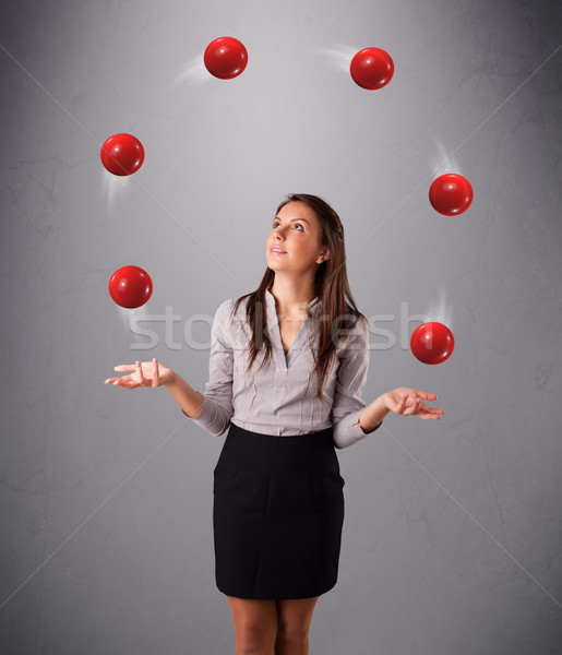 young girl standing and juggling with red balls Stock photo © ra2studio