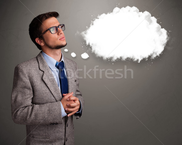 Good-looking young man thinking about cloud speech or thought bubble Stock photo © ra2studio