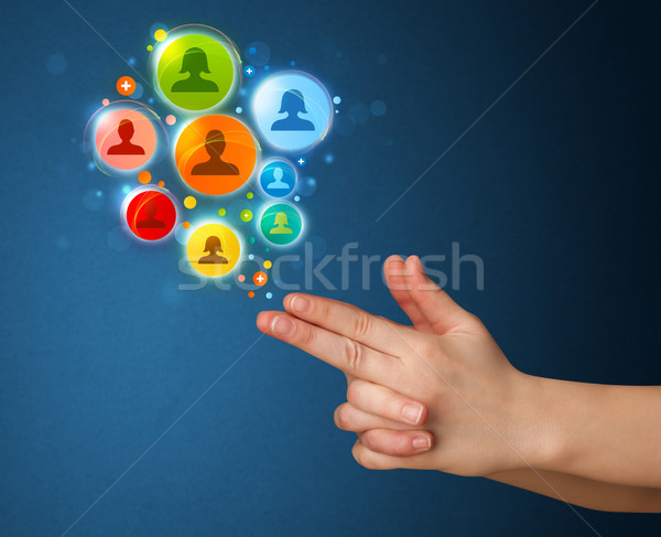 Social media iconen uit pistool hand Stockfoto © ra2studio