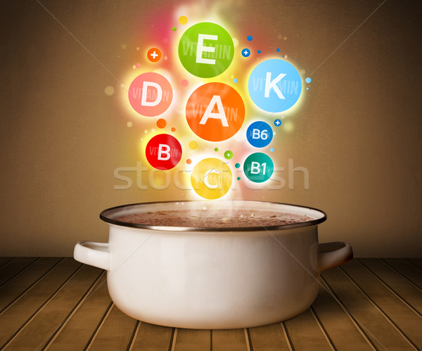 Colorful vitamins coming out from cooking pot Stock photo © ra2studio