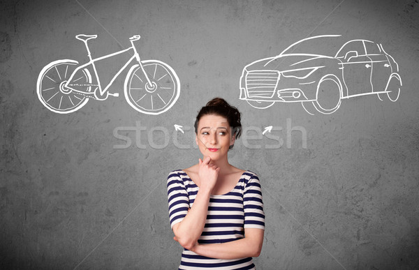 Woman making a choice between bicycle and car Stock photo © ra2studio