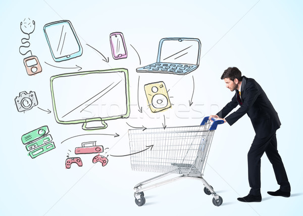 Businessman with shopping cart Stock photo © ra2studio