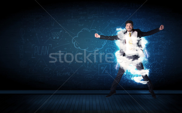 Heureux homme d'affaires sautant tempête nuage autour Photo stock © ra2studio