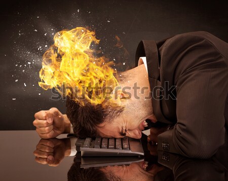 Stressed business man's head is burning Stock photo © ra2studio