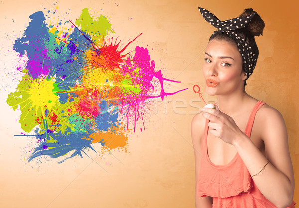 Aranyos lány fúj színes csobbanás graffiti Stock fotó © ra2studio
