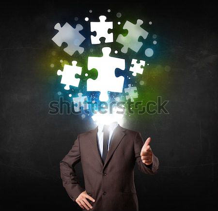 Character in suit with puzzle head concept Stock photo © ra2studio