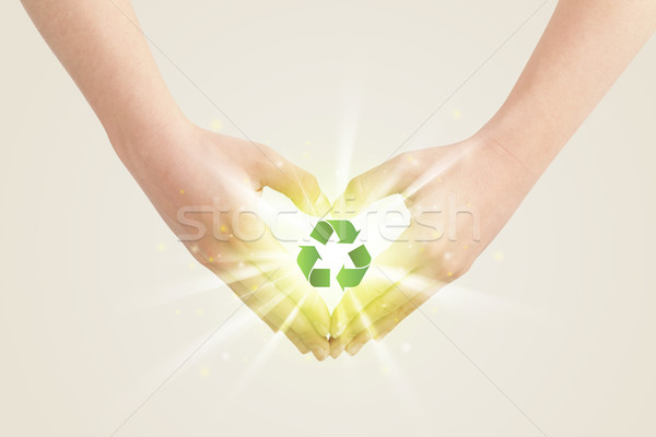 Hands creating a form with recycling sign Stock photo © ra2studio