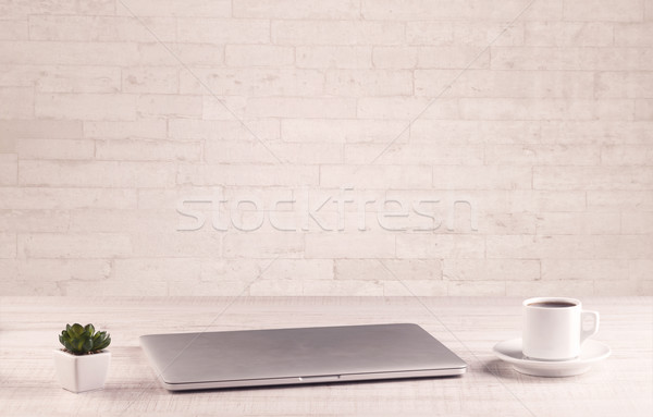 Office Desk Closeup With White Brick Wall Stock Photo C Rancz