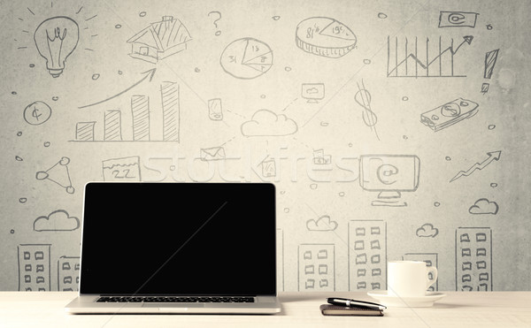 Urban sales graphs and laptop on desk Stock photo © ra2studio
