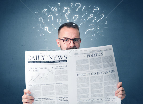 Businessman reading newspaper Stock photo © ra2studio