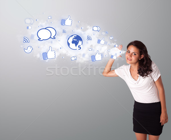 beautiful woman gesturing with social network icons Stock photo © ra2studio