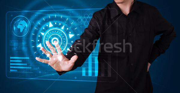 Businessman pressing high tech type of modern buttons Stock photo © ra2studio