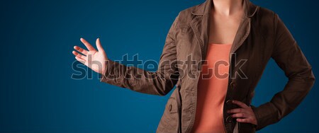 Woman pressing imaginary button Stock photo © ra2studio