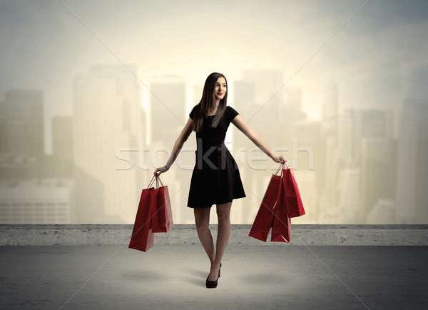 City woman standing with shopping bags Stock photo © ra2studio