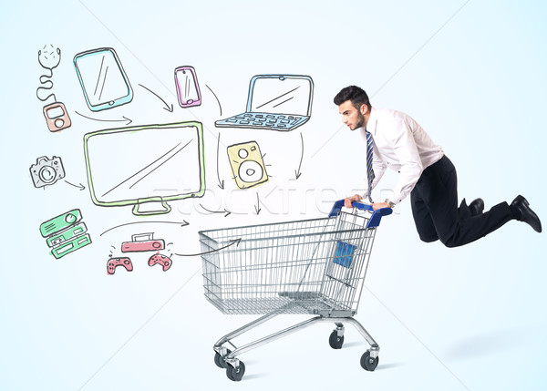 Businessman with shopping cart Stock photo © ra2studio