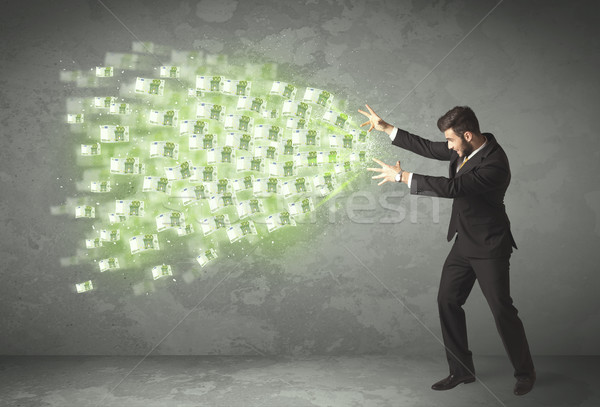 Young business person throwing money concept Stock photo © ra2studio