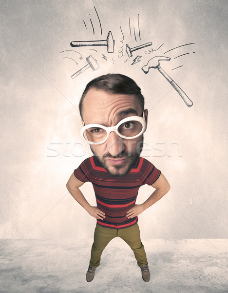 Big head person with drawn hammers Stock photo © ra2studio