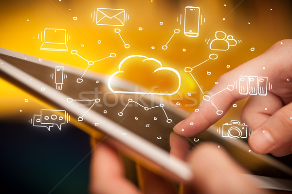 Hand working on tablet with cloud technology system concept Stock photo © ra2studio