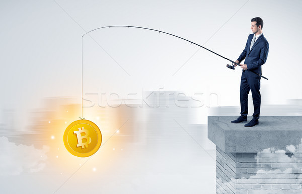 Businessman fishing coins concept Stock photo © ra2studio