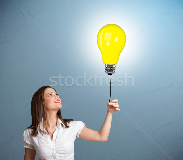 Joli dame ampoule ballon jeune femme [[stock_photo]] © ra2studio