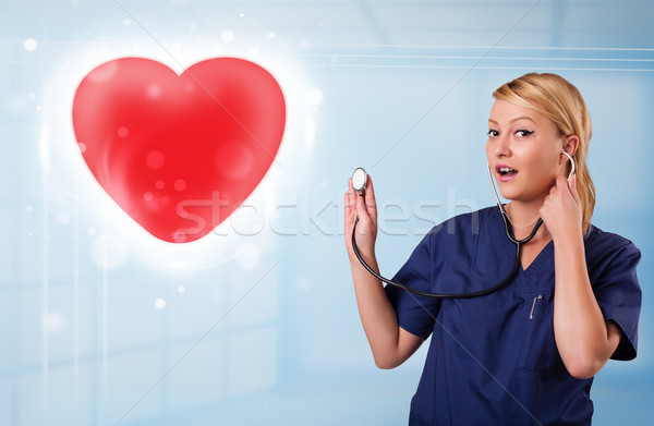 Jeunes infirmière guérison rouge coeur joli [[stock_photo]] © ra2studio