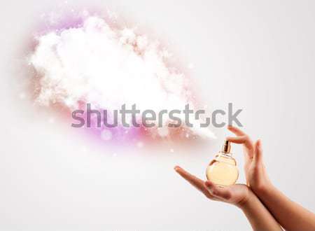 Worker with airbrush painting with glowing golden paint  Stock photo © ra2studio