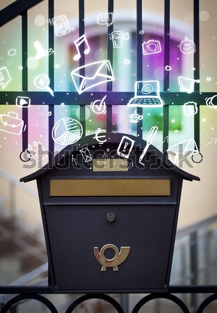 Envelope with email sign dropping into mailbox Stock photo © ra2studio