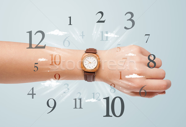 Hand with watch and numbers on the side comming out Stock photo © ra2studio