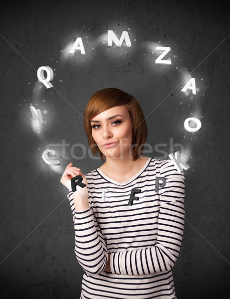 Young woman thinking with letter circulation around her head Stock photo © ra2studio