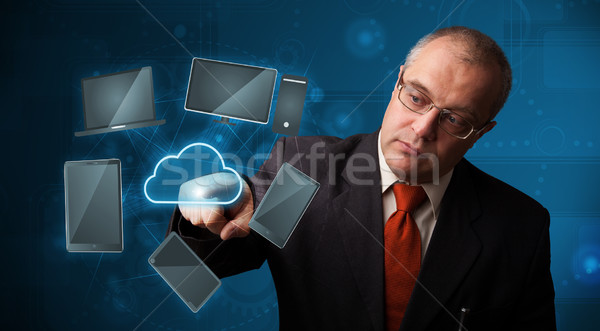 Businessman touching high technology cloud service Stock photo © ra2studio