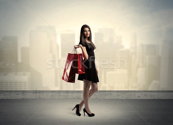 City woman standing with shopping bags Stock photo © ra2studio