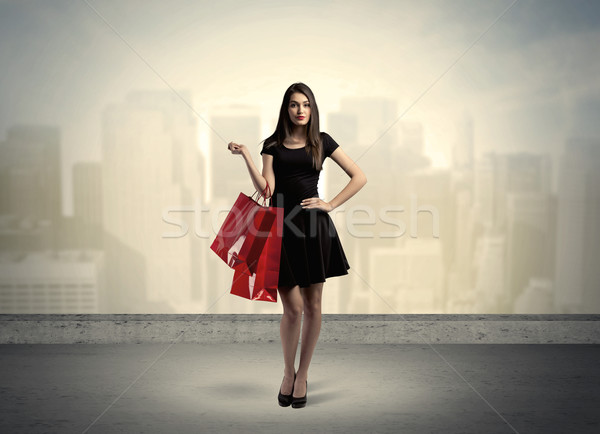 City woman standing with shopping bags Stock photo © ra2studio