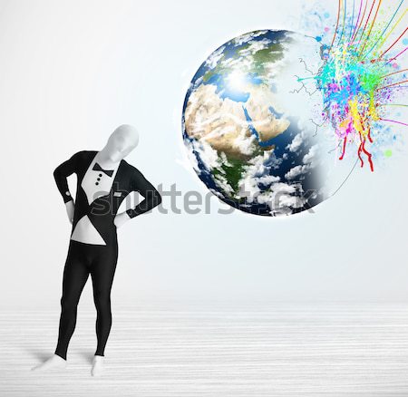 Businesswoman on rock mountain with a globe Stock photo © ra2studio