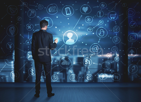 Stock photo: Businessman drawing social media connection scheme