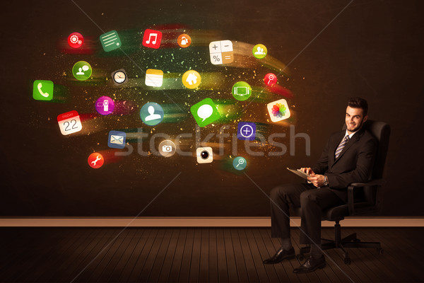Uomo d'affari seduta sedia da ufficio tablet colorato app Foto d'archivio © ra2studio