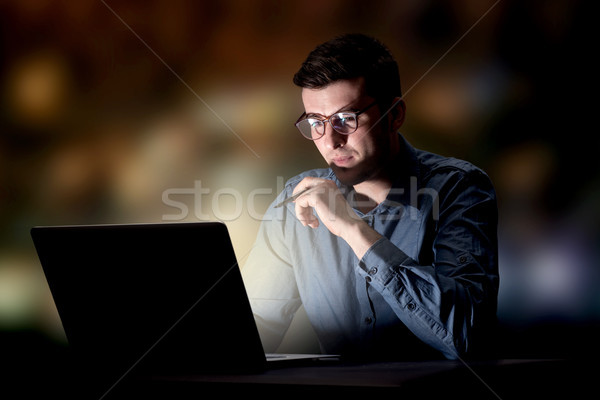 Stock photo: Businessman in the office at night