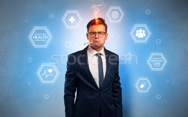 Sick businessman with medical care concept Stock photo © ra2studio