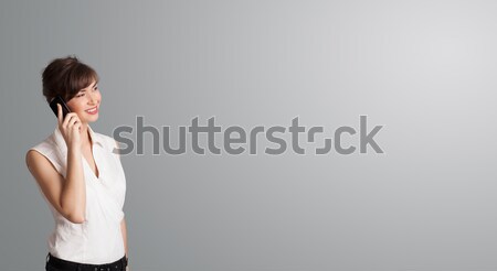 Stock photo: pretty woman making phone call with copy space