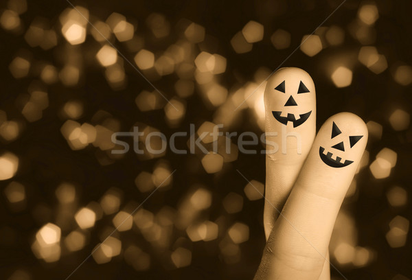 Halloween pumpkin finger hug Stock photo © ra2studio