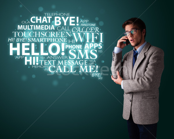 Young man making phone call with word cloud Stock photo © ra2studio