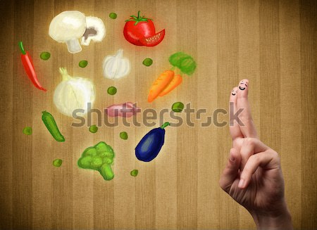 Happy smiley face fingers cheerfully looking at illustration of colorful healthy vegetables Stock photo © ra2studio